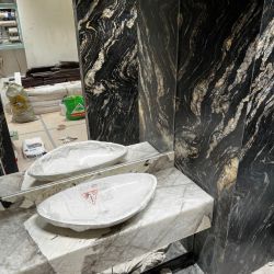 Изображение Облицовка стен и пола натуральным гранитом в ванной в ЖК Макаровский